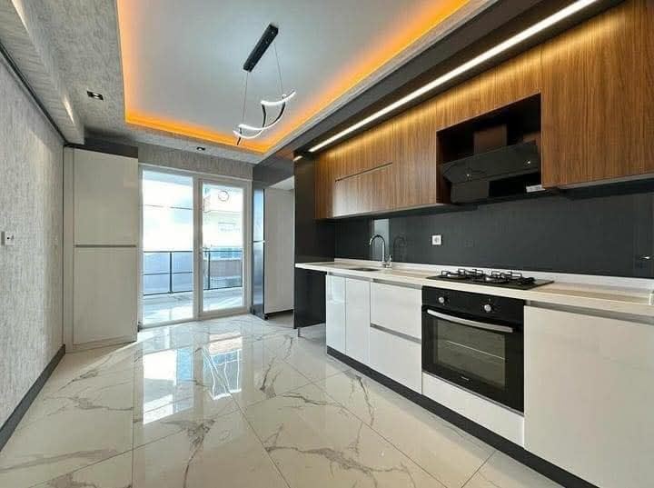 تفصيل مطبخ مودرن أبيض لامع في شمال الرياض - مطابخ خبراء الرياض